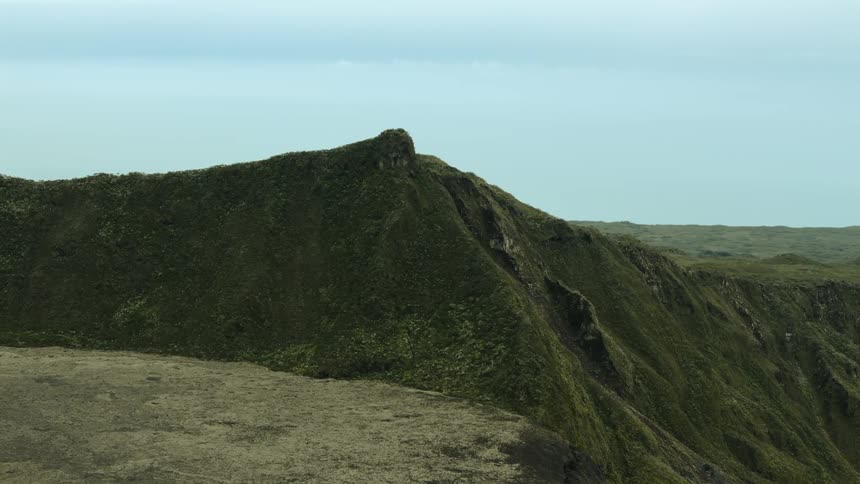 A large mountain and lava fields near Peak of the Furnace volcano