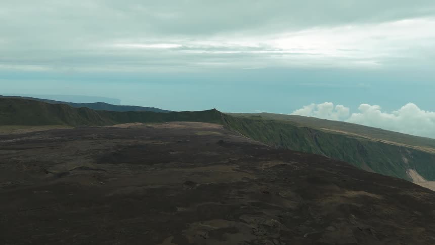 A large mountain and lava fields near Peak of the Furnace volcano
