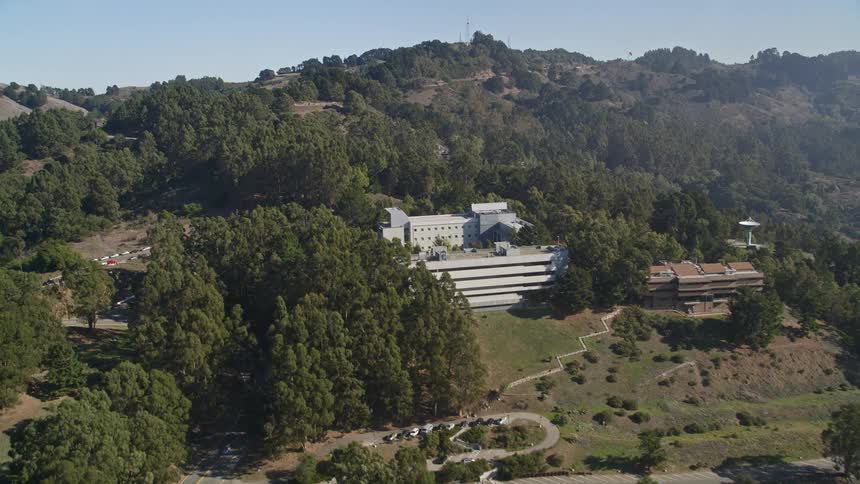 Aerial view of a small community scattered with trees