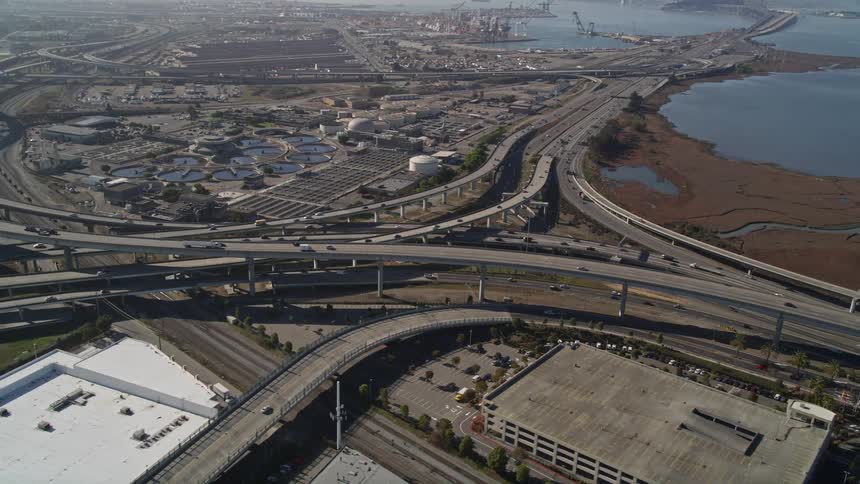 Traffic runs on the highway near the factory