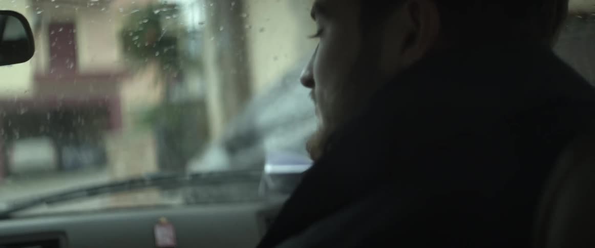 Man sitting in passenger side of car