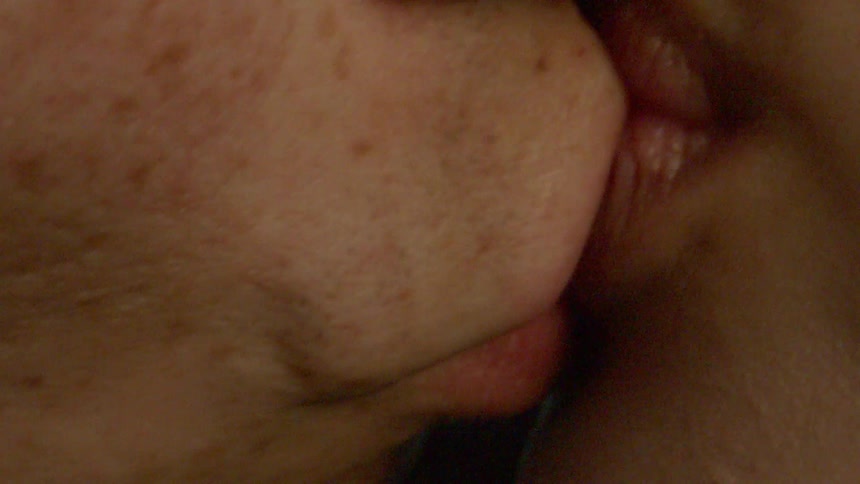 Couple kisses repeatedly with their eyes closed