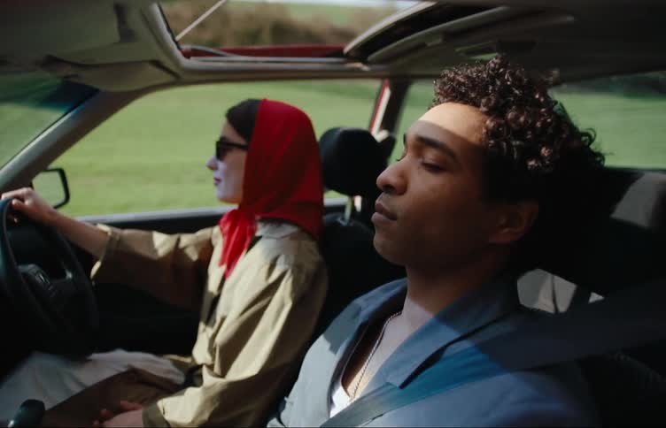 A couple ride in a car