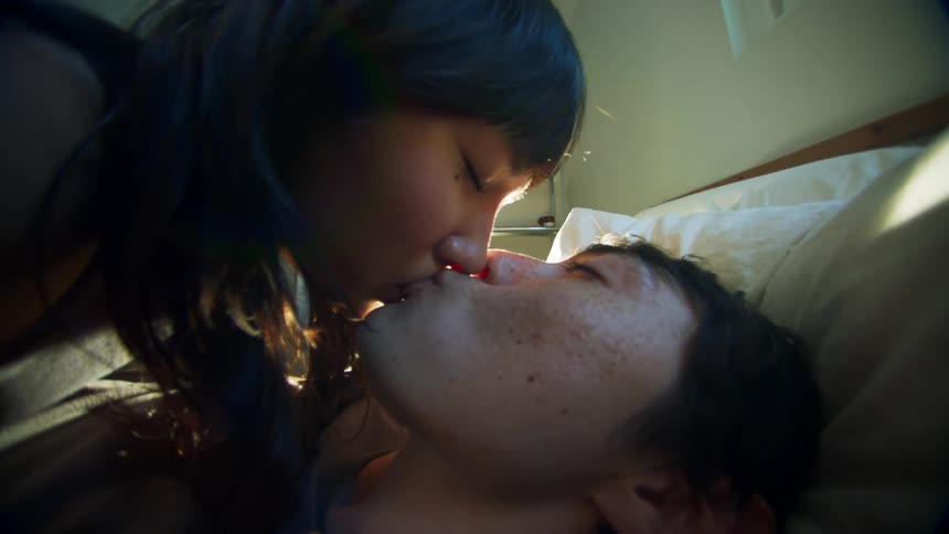 A man and woman kicks off a big color flare