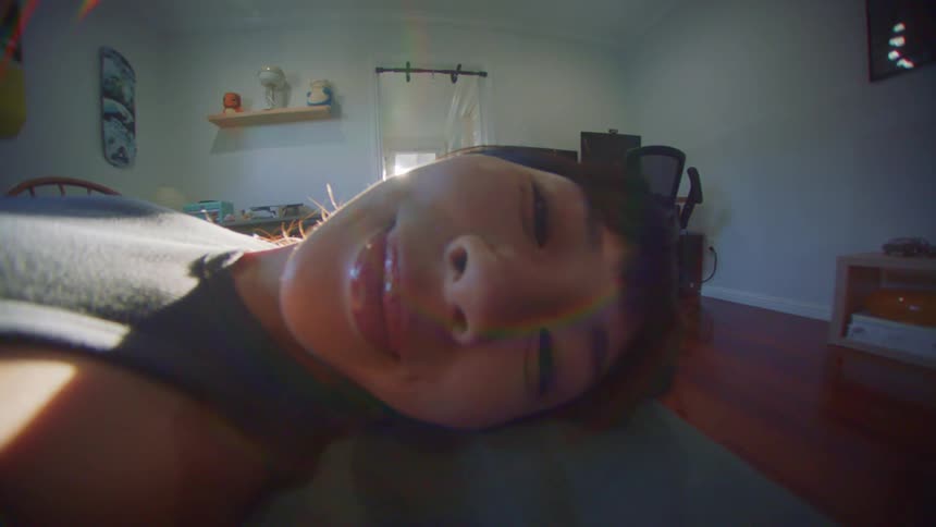 Portrait of a woman lying in bed smiling