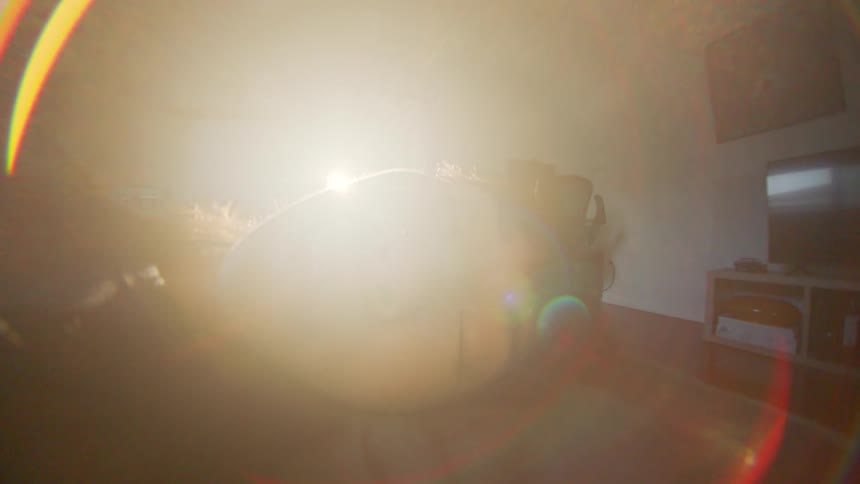 Portrait of a young woman lying in bed sleeping and sunlight reflecting