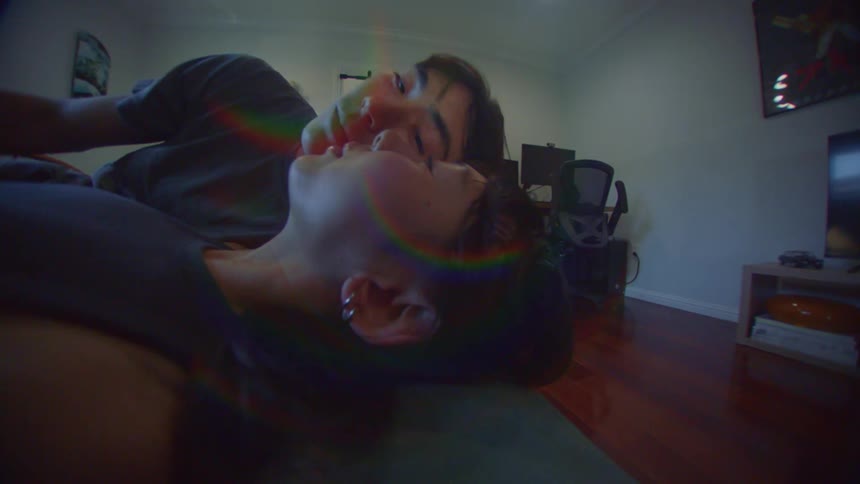 Woman lying in bed and her boyfriend lying next to her