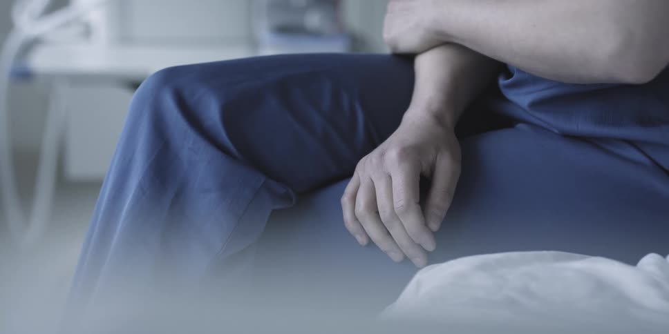 Closeup of a nurses hand sitting inside the hospital