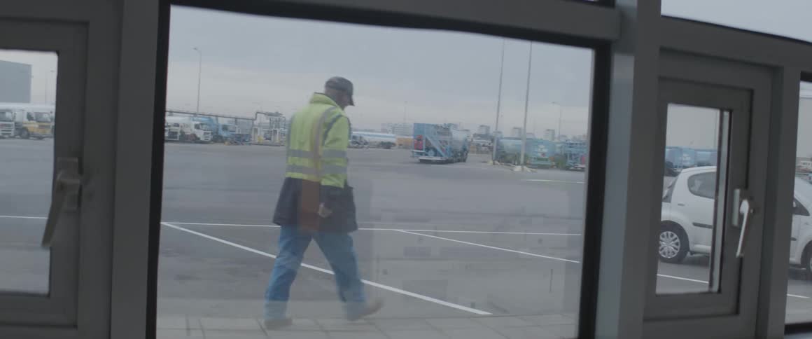 Man wearing a signal suit walking outdoors
