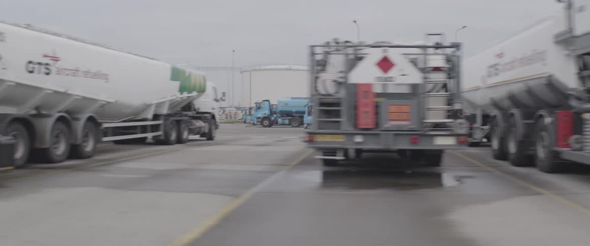 A group large vehicles in an industrial area