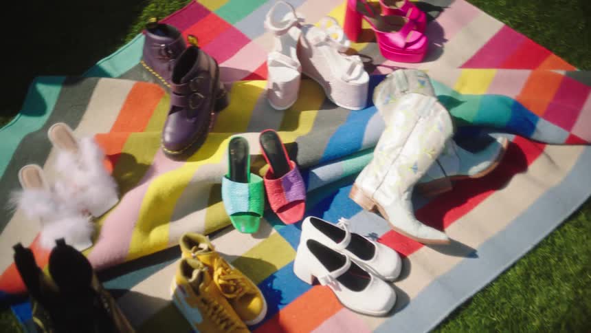 Boots and shoes displayed on a blanket