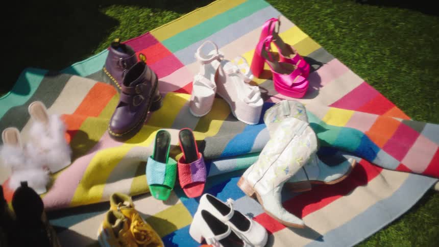 Footwear is laying on the ground outside