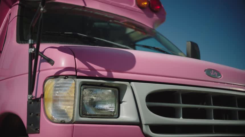 Front part of a pink truck stopped and swaying