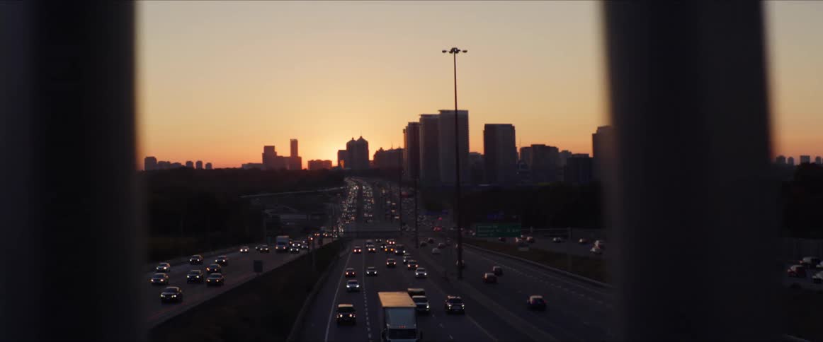 Traffic flows to and from the city at sunrise