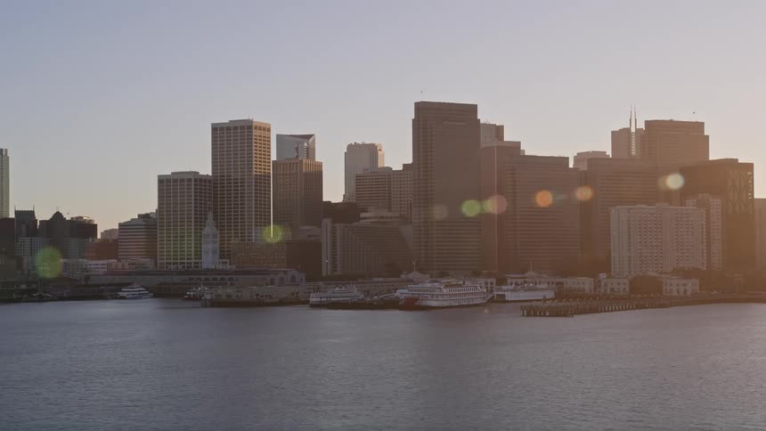 Aerial scenery of a metropolis like skyscrapers by the sea one morning