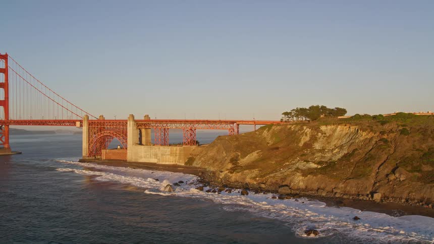 Aerial panorama of a bridge over the sea interconnecting at the coast on a morning
