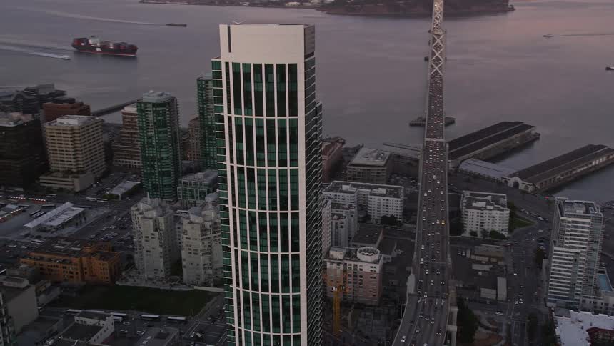 Aerial view of the one rincon hill tower in san francisco at dusk