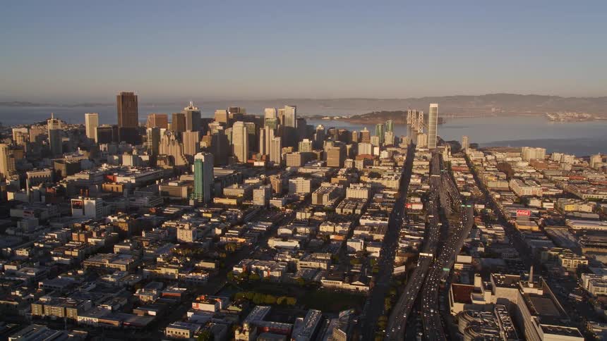 Metropolises with large buildings and seaside urban areas in a morning sky