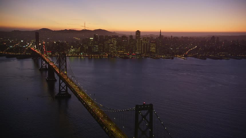 Traffic flows over the bridge towards the city