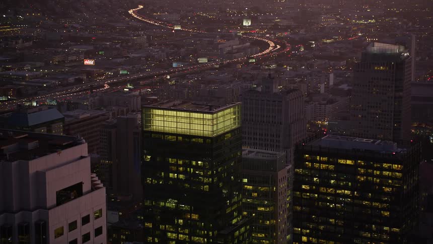 Aerial view of a city skyline in a metropolitan area at dusk