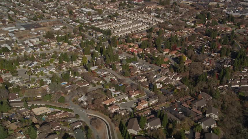 Aerial panorama of an urban city with suburban neighborhoods during the day