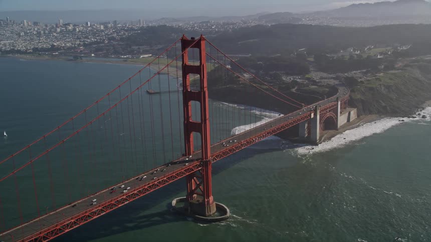 Aerial panorama of the golden gate bridge over the sea with vehicle traffic