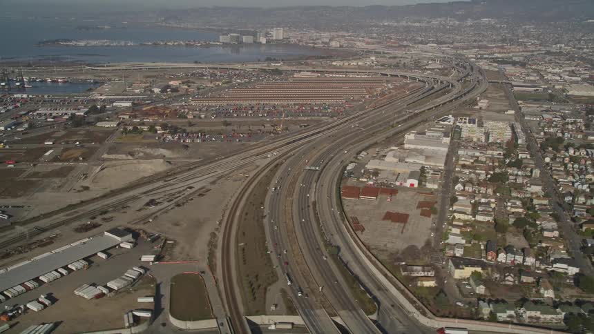 Aerial panorama of a port city with residential areas and extensive highways