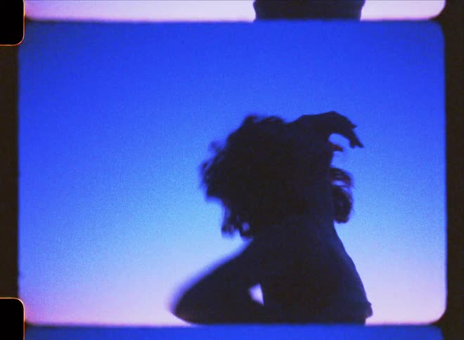 A young woman dances outdoors