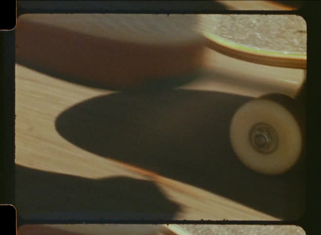 A person rides a skateboard in a street