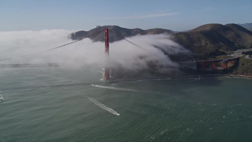 Aerial panorama of the golden gate bridge with fog on a clear day