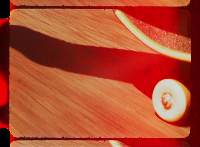 Close up of a person skateboarding caught on vintage film