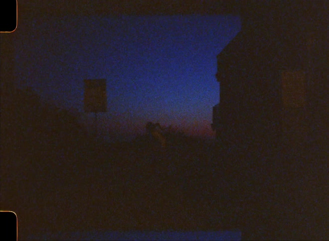 Silhouette of a woman dancing outdoors at night