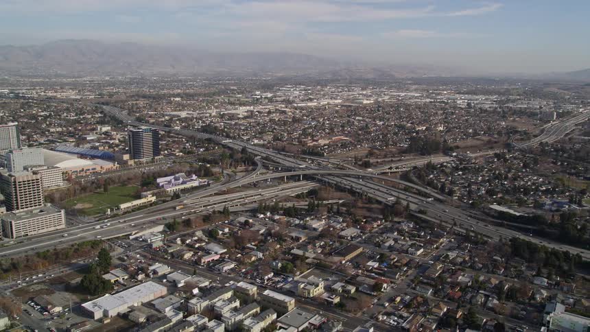 Panorama of an urban city with residential and commercial buildings and viaducts and highways with vehicle traffic