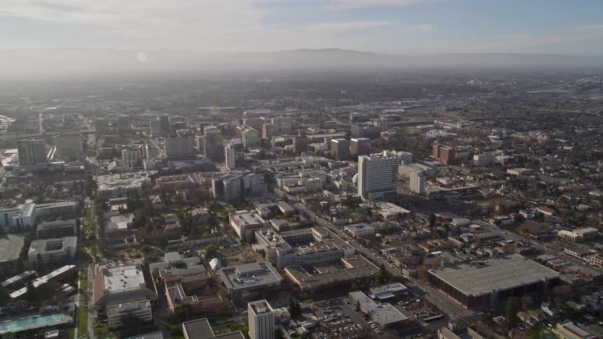 A sprawling downtown area with suburbs in the distance