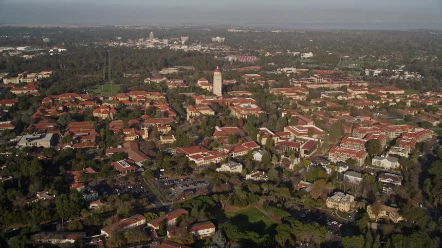 Aerial panorama of an urban city in forested hills