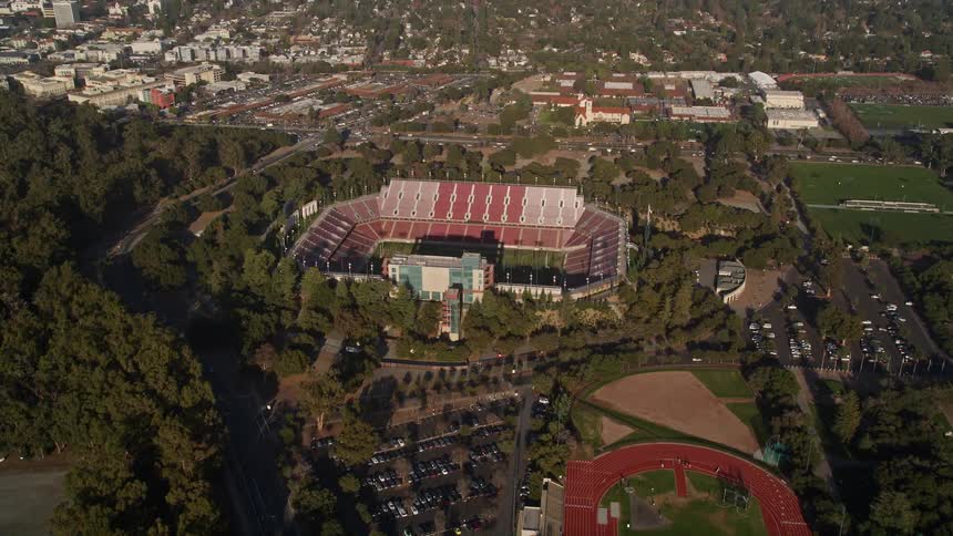 A football stadium is in the middle of the suburbs