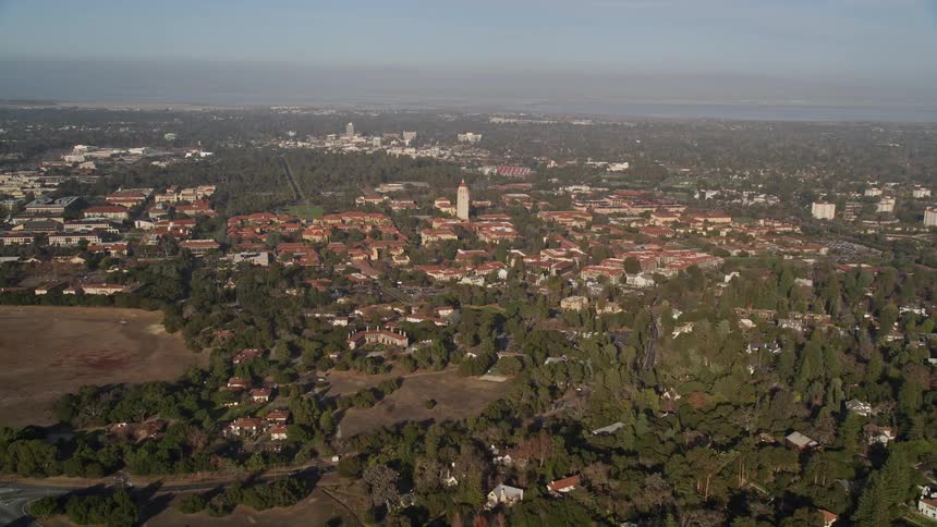 Urban area with houses in wooded hills during the day