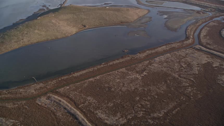 Aerial scenery of a lake covered ground