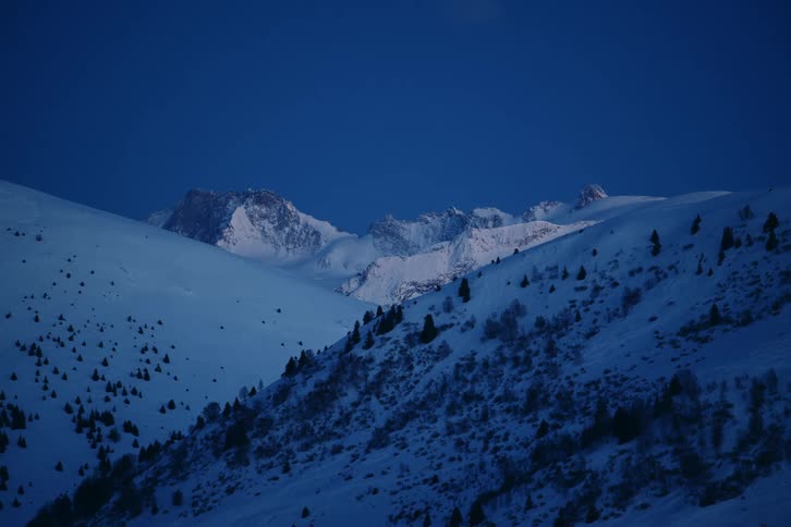 The mountain range is covered with snow