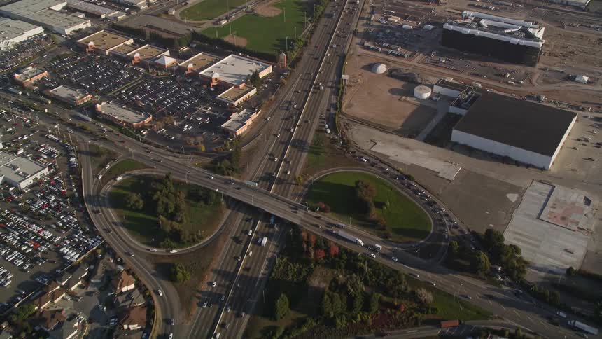 Traffic moves down a highway in a city