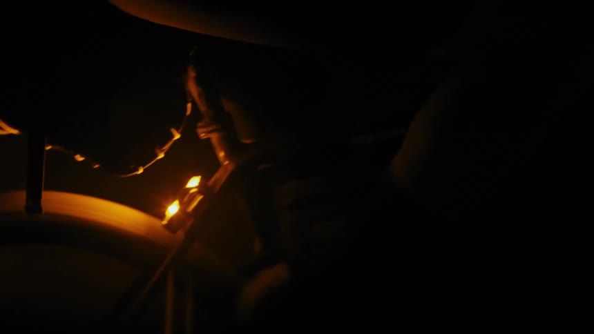 A person cycling at night time orange lights flashing