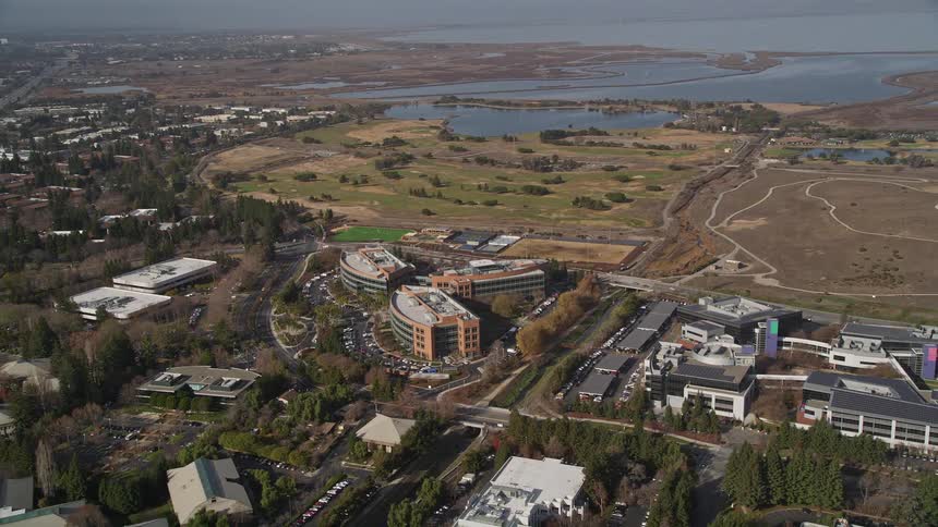 Aerial panorama of a residential neighborhood with urban buildings on the edge of a maritime canal