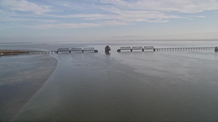 A bridge under construction near a coast