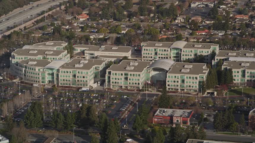 Aerial panorama of commercial and urban buildings with intersections and vehicle traffic during the day