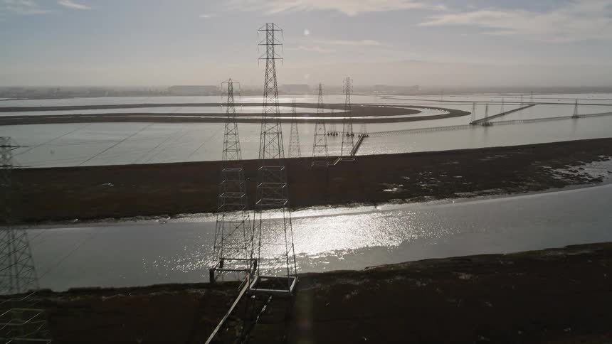 The power lines run over the farm