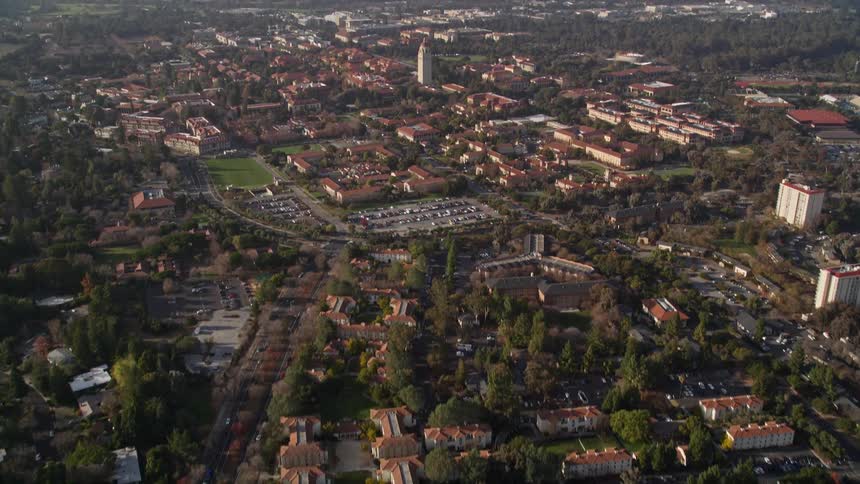 An aerial footage of a city filled with vegetation