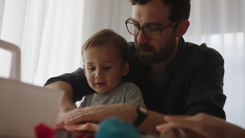 A father plays with his toddler