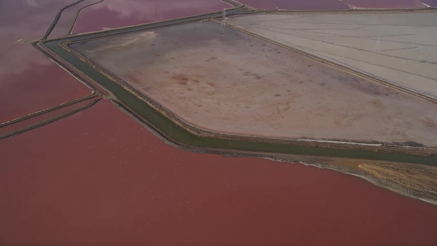 Aerial panorama of canals with water reservoirs in reddish color