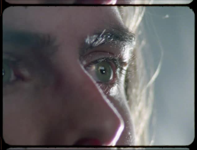 A young woman blinks