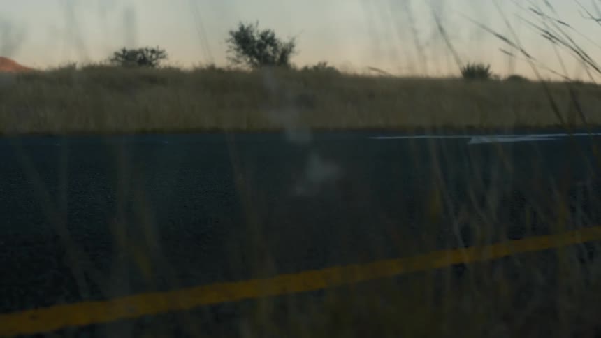 A person rides his bike on the road